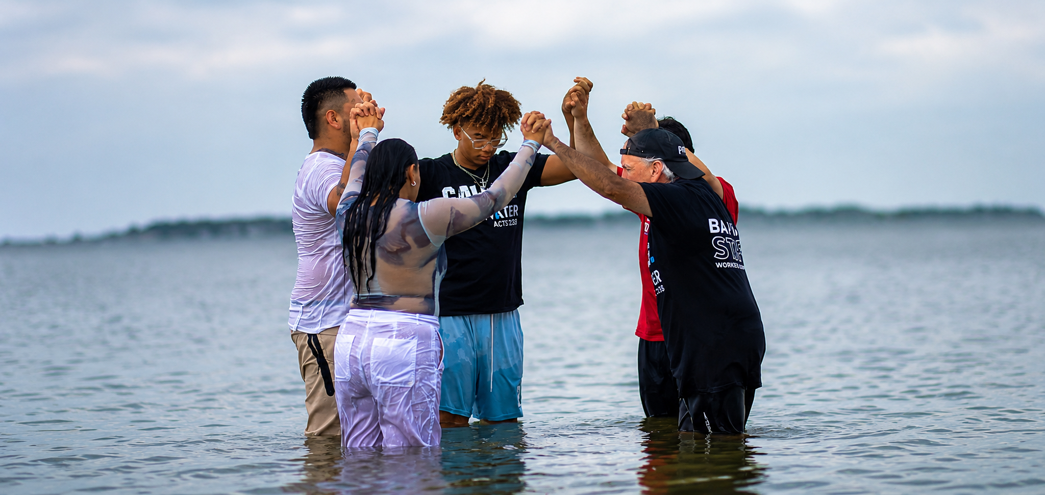 Prayer in the water before baptism